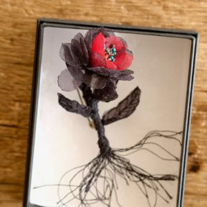 black flower brooch